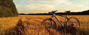Preview wallpaper bicycle, field, grass, horizon, sky