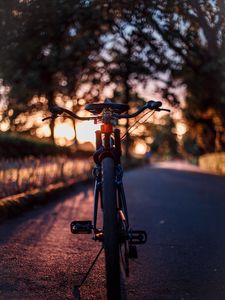 Preview wallpaper bicycle, glare, sunset, motion blur