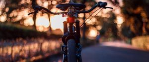 Preview wallpaper bicycle, glare, sunset, motion blur