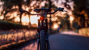 Preview wallpaper bicycle, glare, sunset, motion blur