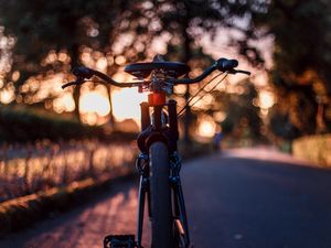 Preview wallpaper bicycle, glare, sunset, motion blur