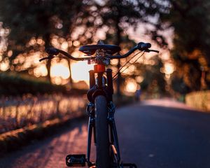 Preview wallpaper bicycle, glare, sunset, motion blur