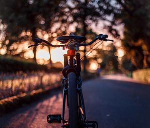 Preview wallpaper bicycle, glare, sunset, motion blur