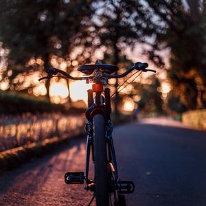 Preview wallpaper bicycle, glare, sunset, motion blur