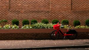 Preview wallpaper bicycle, red, building, road