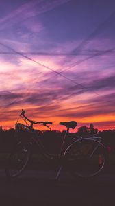 Preview wallpaper bicycle, sunset, sky, road