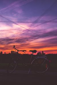 Preview wallpaper bicycle, sunset, sky, road