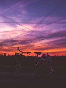 Preview wallpaper bicycle, sunset, sky, road