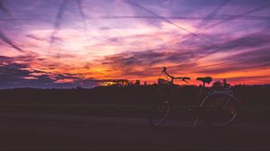 Preview wallpaper bicycle, sunset, sky, road