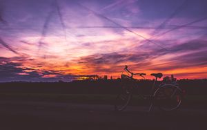 Preview wallpaper bicycle, sunset, sky, road