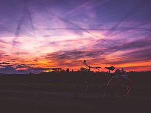 Preview wallpaper bicycle, sunset, sky, road