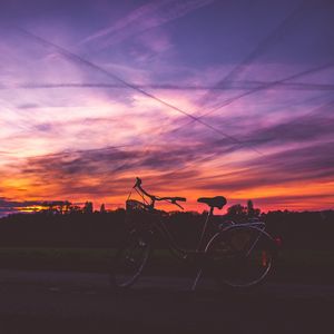 Preview wallpaper bicycle, sunset, sky, road