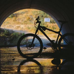 Preview wallpaper bicycle, tunnel, underground, water, reflection