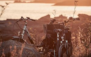 Preview wallpaper bicycle, walk, stone, lake, sunset
