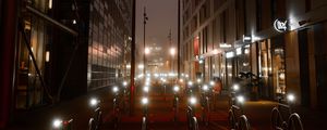 Preview wallpaper bicycles, constructions, road, lights, buildings, night