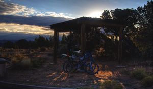 Preview wallpaper bicycles, gazebo, parking, sunset, puddle, travel, utah