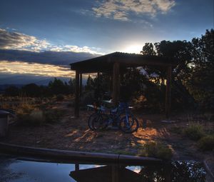 Preview wallpaper bicycles, gazebo, parking, sunset, puddle, travel, utah