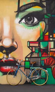 Preview wallpaper bicycles, graffiti, face, wall