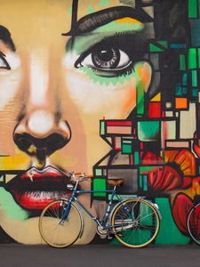 Preview wallpaper bicycles, graffiti, face, wall