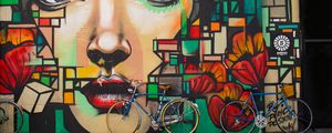 Preview wallpaper bicycles, graffiti, face, wall