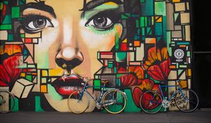 Preview wallpaper bicycles, graffiti, face, wall