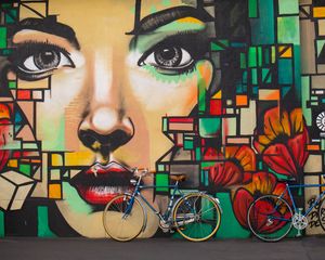 Preview wallpaper bicycles, graffiti, face, wall