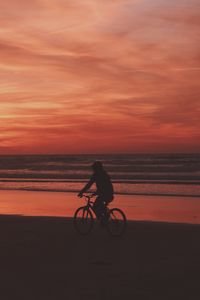 Preview wallpaper bicyclist, sea, shore, sunset