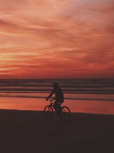 Preview wallpaper bicyclist, sea, shore, sunset