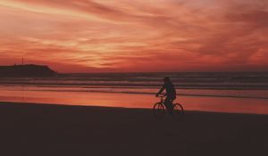 Preview wallpaper bicyclist, sea, shore, sunset