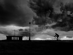 Preview wallpaper bicyclist, silhouette, bw, clouds, night