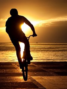 Preview wallpaper bicyclist, trick, jump, extreme, sun, quay