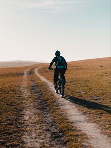 Preview wallpaper bike, cyclist, road, field