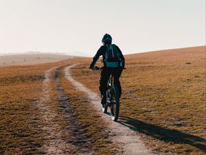 Preview wallpaper bike, cyclist, road, field