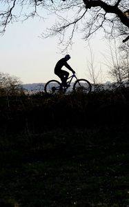 Preview wallpaper bike, cyclist, silhouette, riding, sport, trees, dark