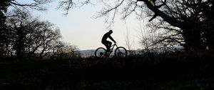 Preview wallpaper bike, cyclist, silhouette, riding, sport, trees, dark