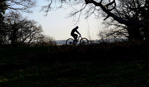 Preview wallpaper bike, cyclist, silhouette, riding, sport, trees, dark