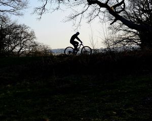 Preview wallpaper bike, cyclist, silhouette, riding, sport, trees, dark