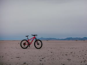 Preview wallpaper bike, horizon, sand, sky