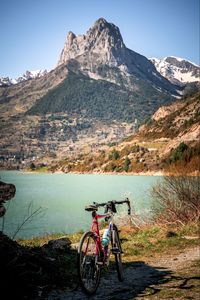 Preview wallpaper bike, mountains, lake, road, nature
