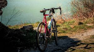 Preview wallpaper bike, mountains, lake, road, nature