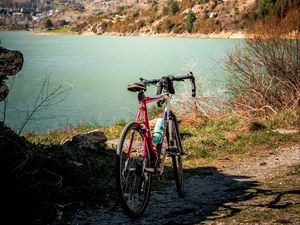 Preview wallpaper bike, mountains, lake, road, nature