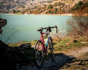 Preview wallpaper bike, mountains, lake, road, nature