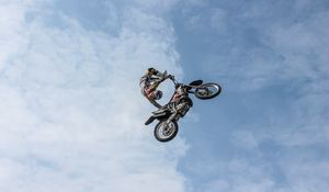 Preview wallpaper biker, motorcycle, extreme, trick, clouds, sky
