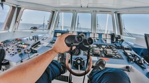 Preview wallpaper binoculars, hand, steering wheel, ship, control