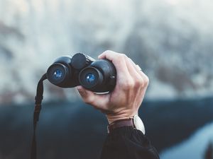 Preview wallpaper binoculars, hand, watch, focus