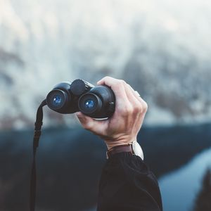 Preview wallpaper binoculars, hand, watch, focus