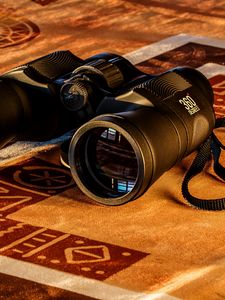 Preview wallpaper binoculars, lenses, gold, glow, reflection