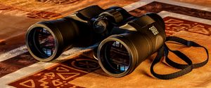 Preview wallpaper binoculars, lenses, gold, glow, reflection
