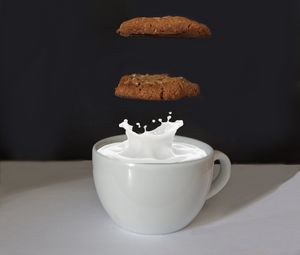 Preview wallpaper biscuits, milk, cup, drop, dessert