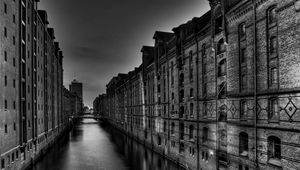 Preview wallpaper black white, building, tall, river, bridge, night